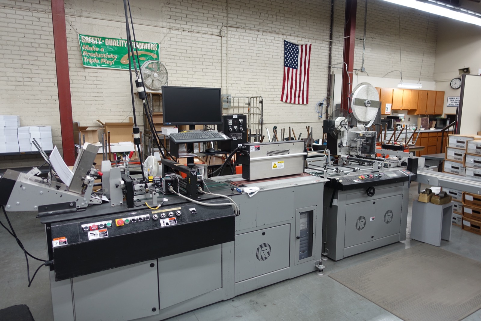 The inserting and addressing line running a mailing at Broudy Printing